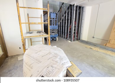 Construction Site At Commercial Space With Architect Blueprint Plan