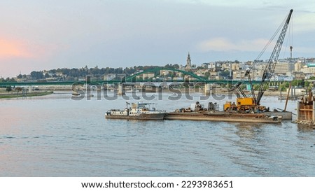 Construction Site Crane at River Barge With Tugboat River Sava Belgrade Dusk Stok fotoğraf © 