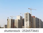 construction site with cranes, building under construction