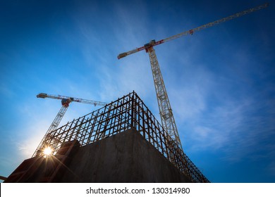 Construction site and cranes sky background