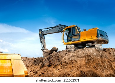 construction site digger, excavator and dumper truck. industrial machinery on building site