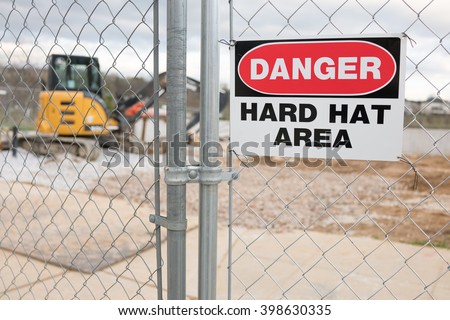 Construction Site Fence With Danger Hard Hat Area Warning