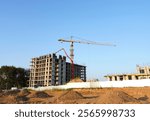 Construction site. Formworks, Building construction. Pouring concrete, сoncrete pump truck to a ready-mixed. Tower crane on building construction. Concrete Pump Machinery on Formworks. Renovation.