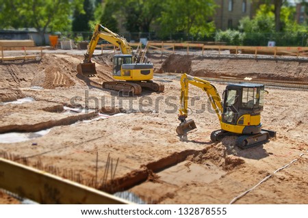 Construction site foundation with excavator