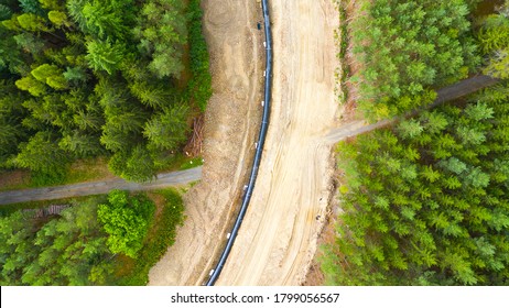Construction site of gas pipeline in deep forest. Devastated landscape in natural park Slavkovsky les in Western Bohemia. Czech Republic, European Union.