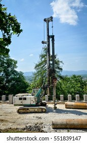 Construction Site With Large Mobile Crane Hydraulic Drill Rig Machine. Drilling A Large Hole For Heat Pump With Heavy Machinery.