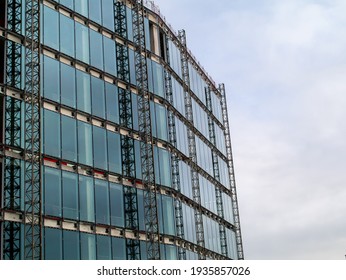 Construction Site Of Modern Office And Residential Building. Concrete Frame And Glass Windows. Development Industry Concept.