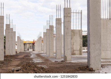 construction site with new concrete columns reinforcing steel