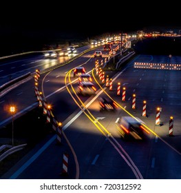 A Construction Site On A Highway At Night