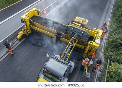 Construction site roadwork, new asphalt layer - Shutterstock ID 709326856