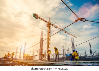 construction site and sunset , structural steel beam build large residential buildings at construction site .