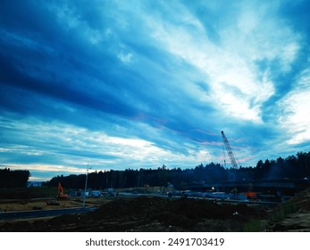 construction site under the dramatic sunset clouds background