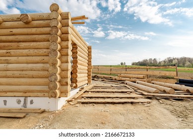 Construction Site Of Wooden Mountain House. Traditional Log Cabin Built From Wood Logs On Sunny Summer Day. Cottage House Design