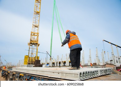 Construction site workers. Construction of the new building - Shutterstock ID 609025868