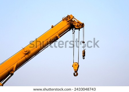 Construction site with yellow crane