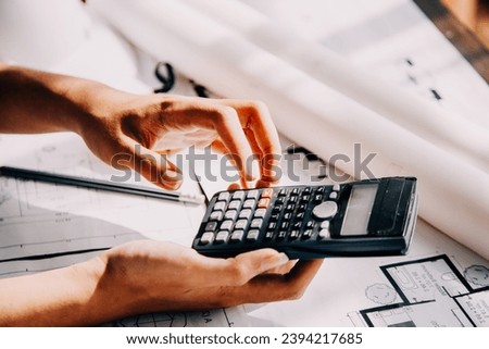 Construction and structure concept of Engineer or architect meeting for project working with partner and engineering tools on model building and blueprint in working site, contract for both companies.