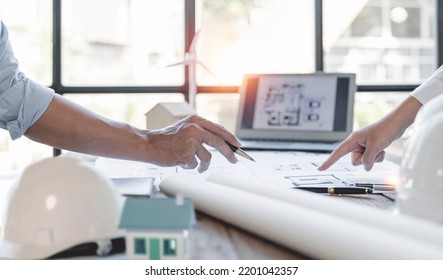 Construction and structure concept of engineer working on blueprint meeting for project working with partner in working site, construction concept  - Shutterstock ID 2201042357