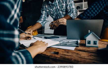 Construction and structure concept of engineer working drawing on blueprint meeting for project working with partner on model building and engineering tools in working site, construction concept