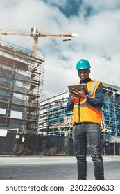 Construction, tablet and engineer man outdoor for project management, development and architecture. Happy black male contractor with mobile app for engineering and safety inspection or city planning