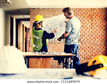 Construction team working on a blueprint
