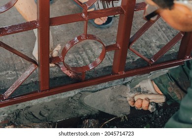 Construction Technicians With Hearing Aid Working With Cement Paving, Mix With Trowel At Side Work In Backyard. Cement Mortar Powder Put On Brick. Real Candid Farm Craftsman Worker Bricklaying.