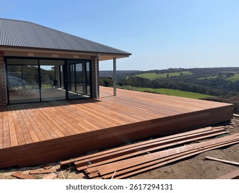 Construction of timber deck looking over a valley 