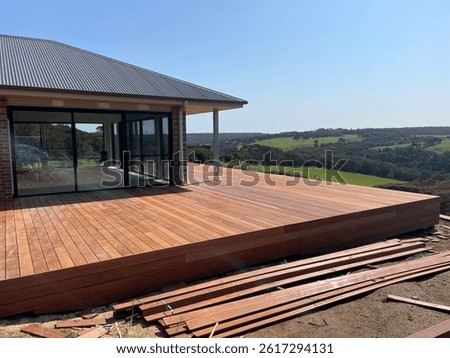 Construction of timber deck looking over a valley 