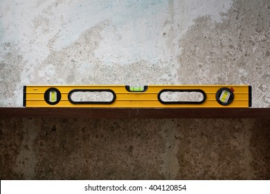 Construction tool Bubble spirit level on line at concrete background. Copy space for text - Shutterstock ID 404120854