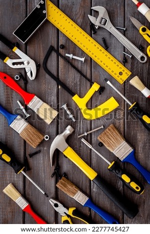 Construction tooling set with brushes and hammer. House improvement background.