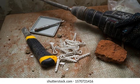 Construction tools on a background of brick dust.