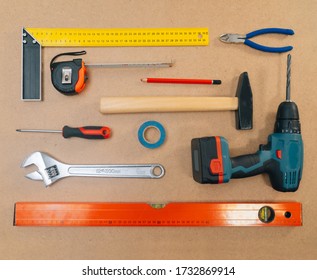 Construction tools on a light background. The concept of using tools to make repairs in an apartment.