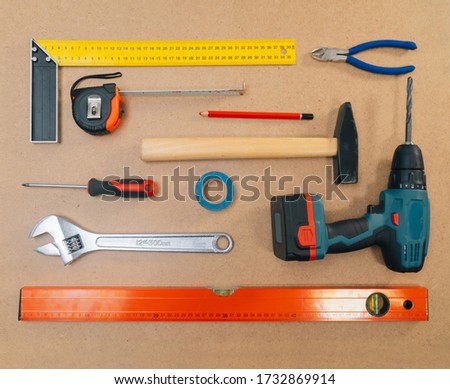 Construction tools on a light background. The concept of using tools to make repairs in an apartment.