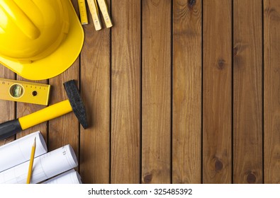 Construction Tools On A Wooden Background 