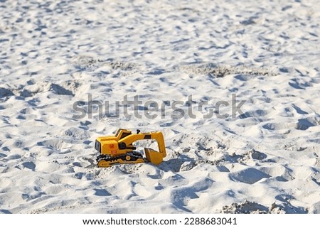 A construction toy on the beach
