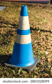 Construction traffic cones urging caution and compliance with regulations.