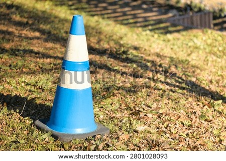 Construction traffic cones urging caution and compliance with regulations.