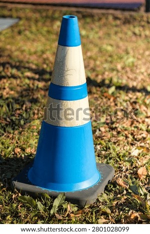 Construction traffic cones urging caution and compliance with regulations.