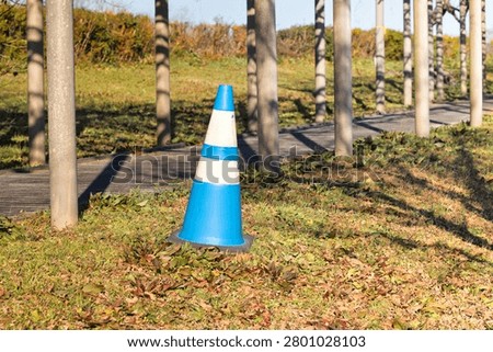 Construction traffic cones urging caution and compliance with regulations.