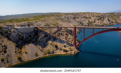 Construction for transportation and viability in the middle of natural coastal landscape. Bridge over the sea to connect two opposite parts. Maslenica Bridge, Croatia. - Powered by Shutterstock