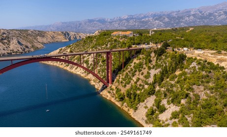 Construction for transportation and viability in the middle of natural coastal landscape. Bridge over the sea to connect two opposite parts. Maslenica Bridge, Croatia. - Powered by Shutterstock