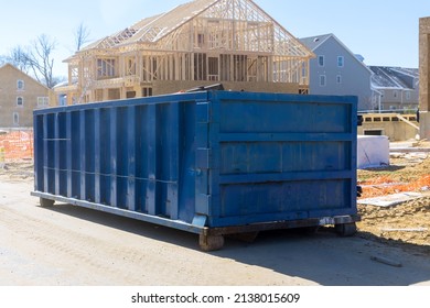 Construction trash dumpsters on metal container, house renovation. - Shutterstock ID 2138015609