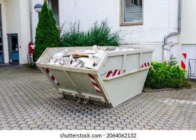 Construction waste container full of construction waste