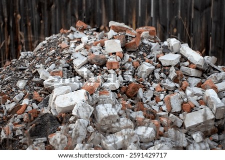 Construction waste with elements of and destroyed old structures at municipal landfill