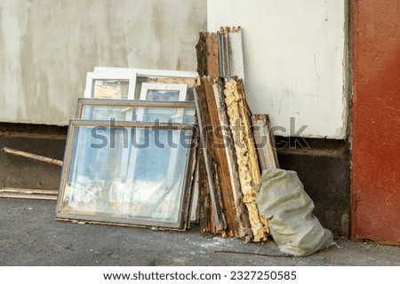 Construction waste. Old window frames folded for disposal