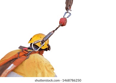 Construction welder wearing safety helmet, fall arrest harness clipping retractable an inertia reel shock absorbing fall protection device safety harness loop isolated white background