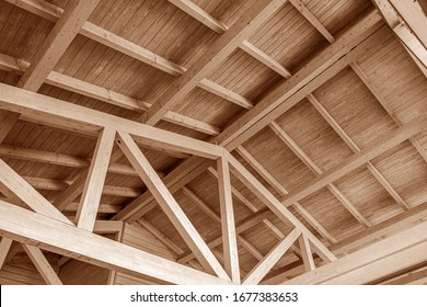 The construction of the wooden roof. Detailed photo of a wooden roof overlap construction. - Shutterstock ID 1677383653