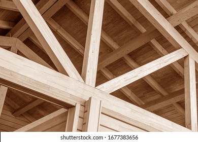 The construction of the wooden roof. Detailed photo of a wooden roof overlap construction. - Shutterstock ID 1677383656