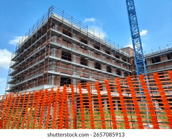 
Construction work in progress on a city construction site in the summer - building a new condominium