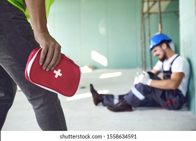 Construction worker accident with a construction worker. First aid for injury at work.