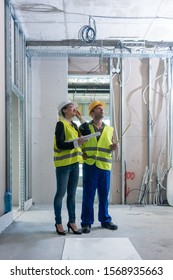 Construction Worker And Architect Discussing Work To Be Done At Site To Finish The Building